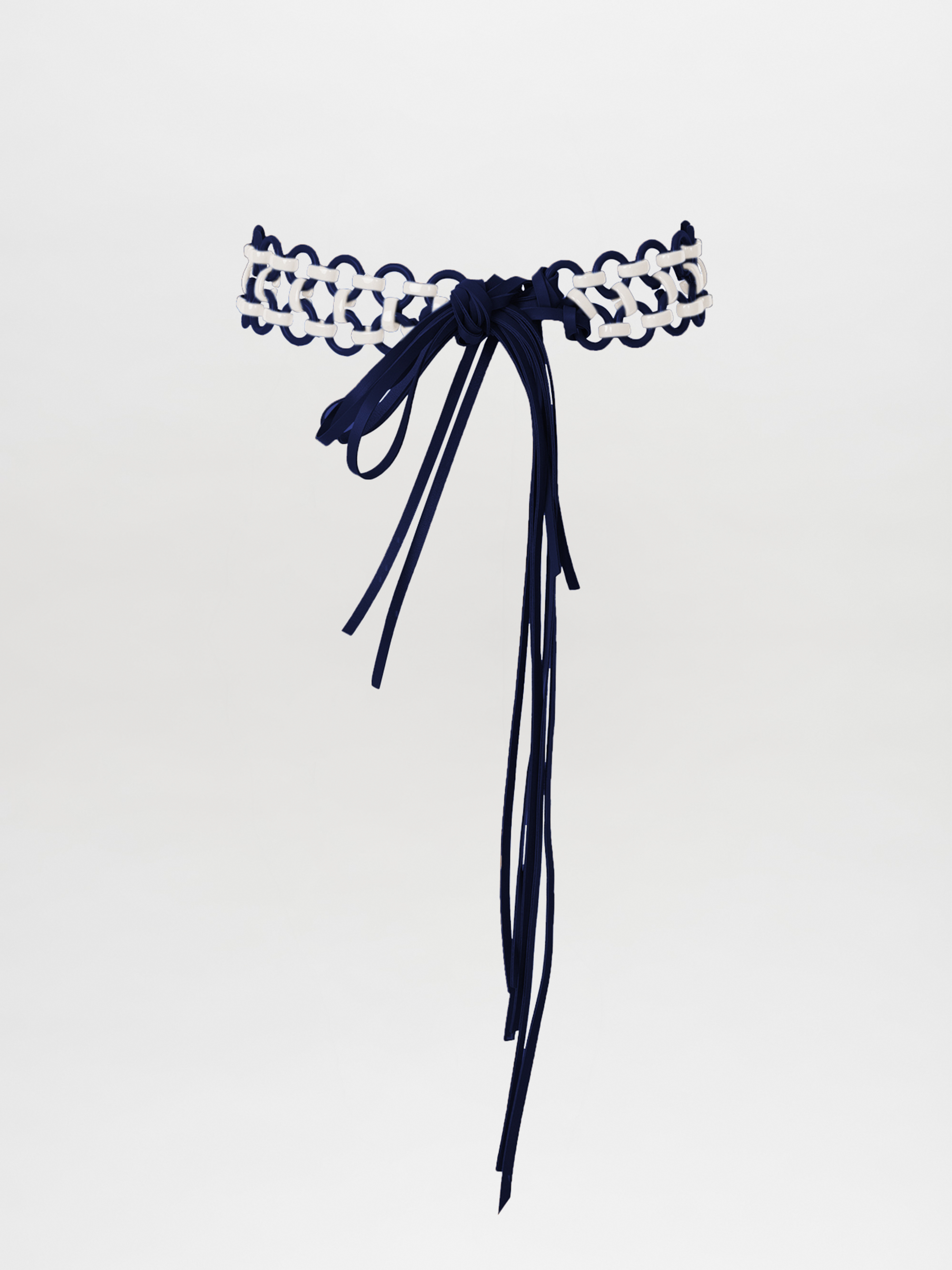 The Sindione Belt Navy White showcases navy and white braided cords with a long navy bow and extended tassels, all elegantly displayed on a white background.