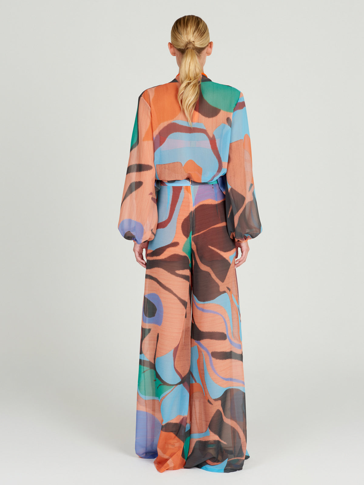 A woman's high-waisted Benedetto Pant Pastel Multi Swirls palazzo pants.