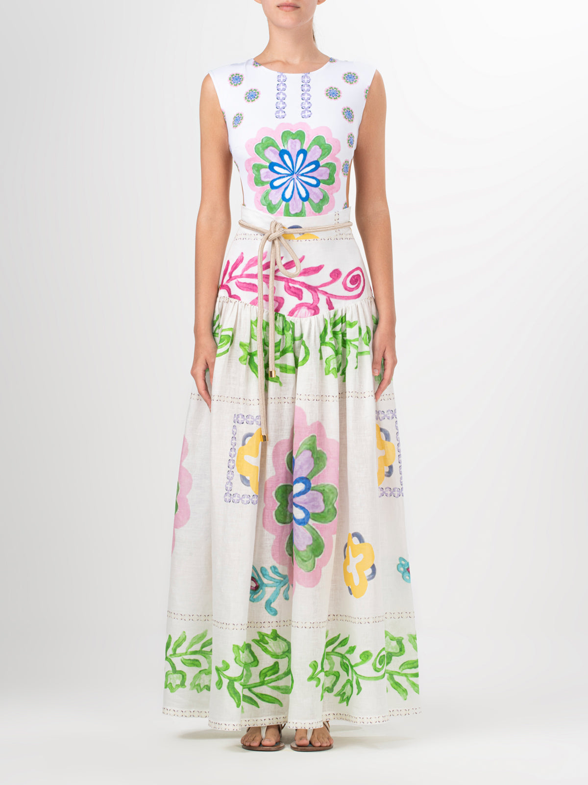 A woman wearing an Abla Skirt Multicolor Floral Print with abstract floral designs.