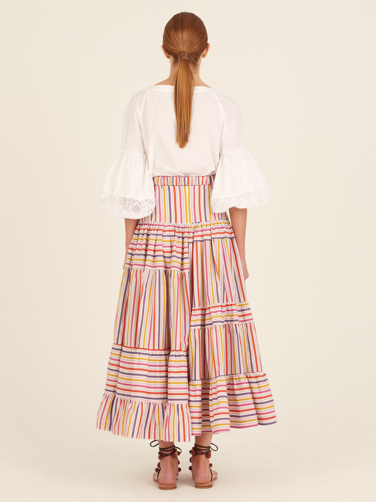 Alba Blouse White with three-quarter sleeves and lace details on a plain background.