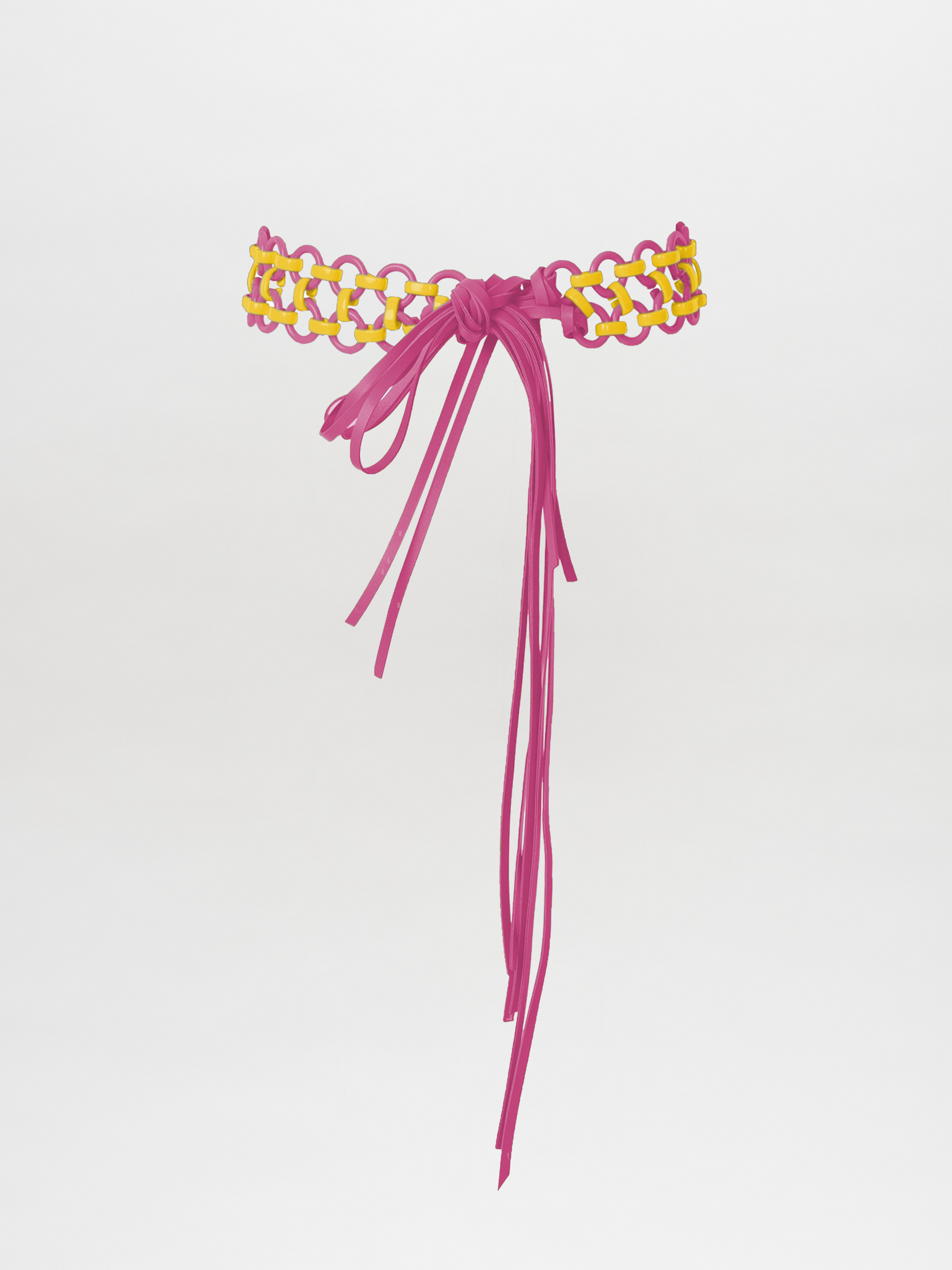 The Sindione Belt Fuschia / Yellow, featuring a pink and yellow woven design with a magenta hue and an elegant bow, is displayed against a plain background.