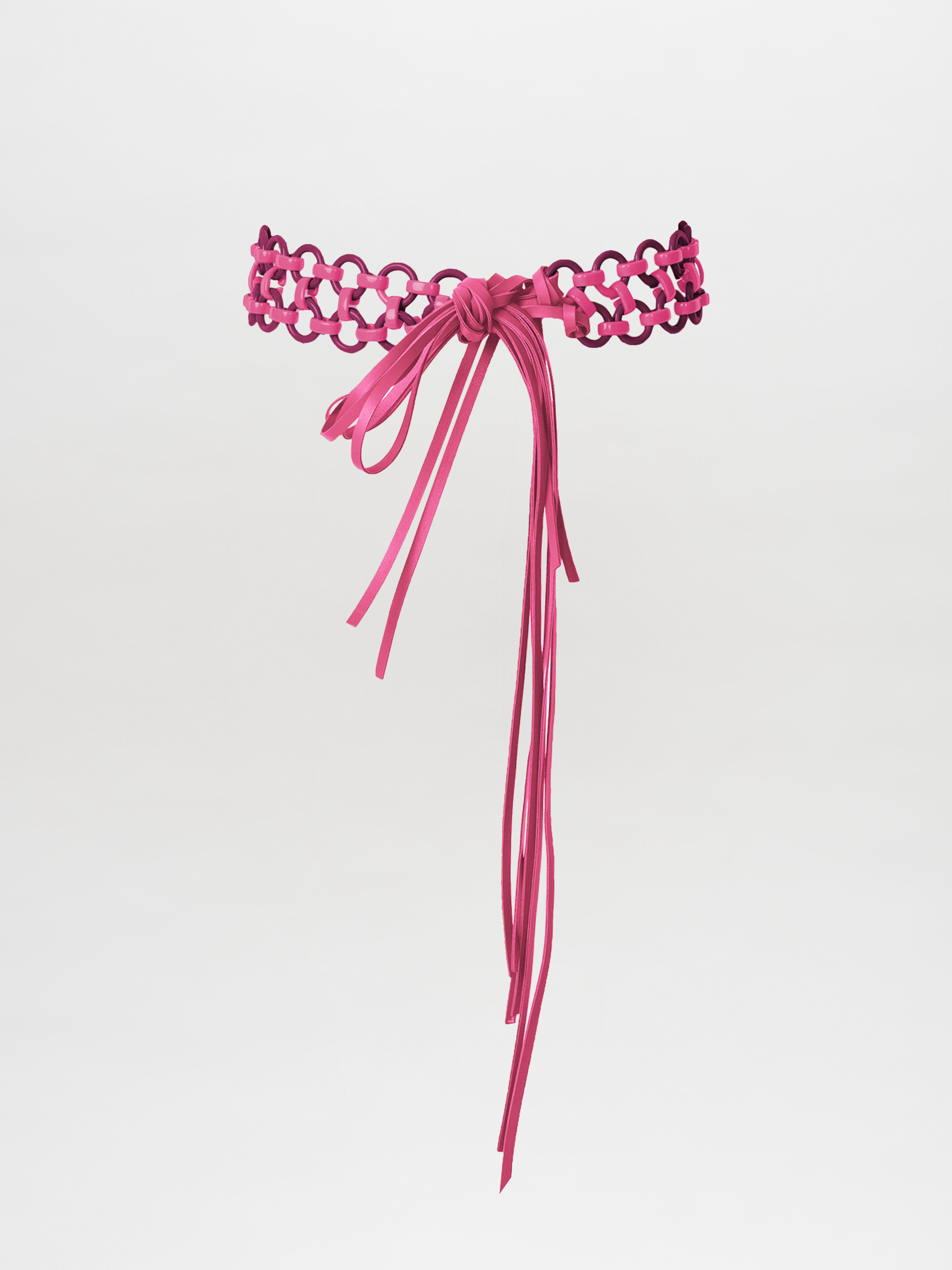 An isolated pink lace Sindione Belt Magenta / Plum featuring a bow and long tassels on a white background.